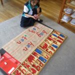 Sea Star student uses moveable alphabet